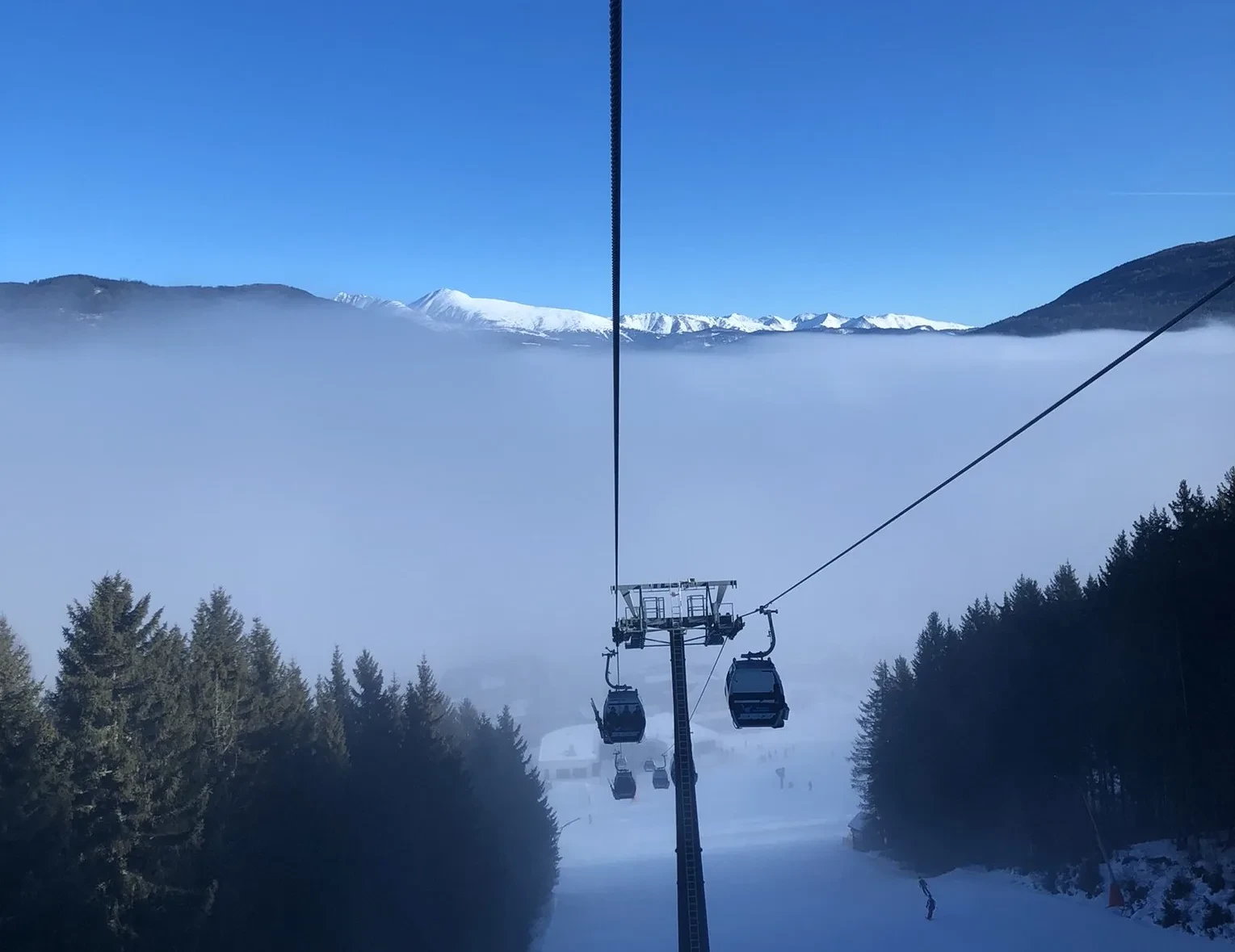 Gondola above a sea of clouds in the ski area
