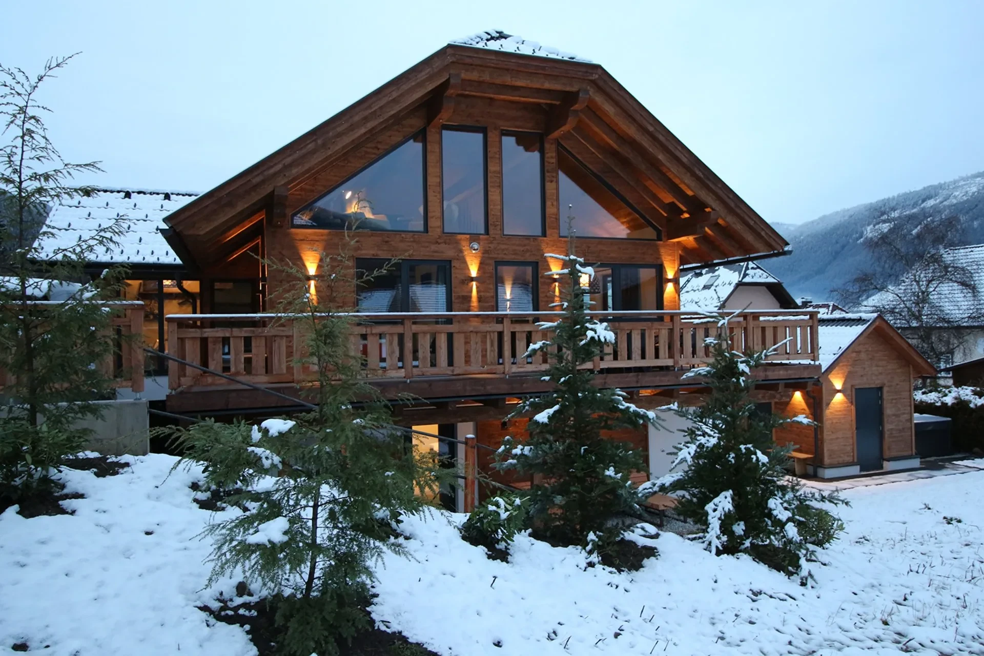Chalet in winter with lit windows